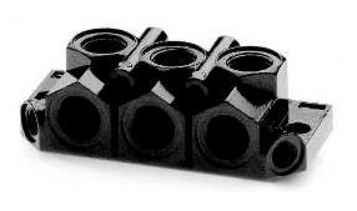 End blocks for manifold bases with front outlets